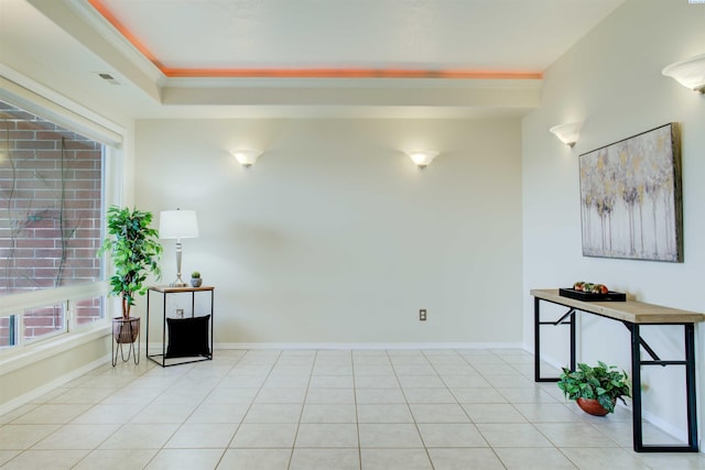 tiled spare room with ornamental molding