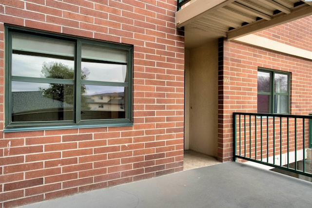 entrance to property featuring a balcony