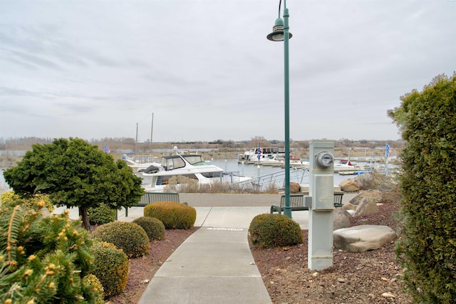 surrounding community featuring a water view