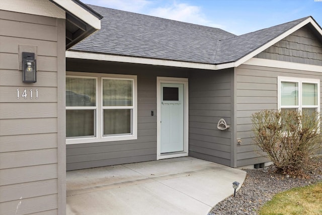 entrance to property with a patio