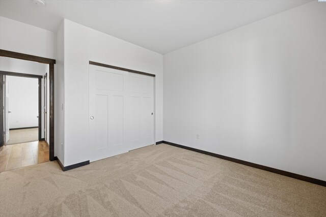 6701 Sockeye Ln, Pasco, WA 99301 - unfurnished bedroom with light carpet and a closet