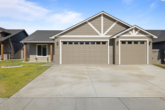 view of front of property with a garage and a front lawn