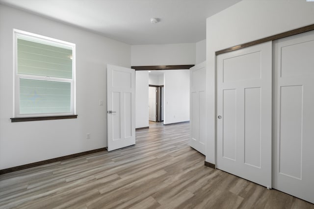 6701 Sockeye Ln, Pasco, WA 99301 - unfurnished bedroom featuring light hardwood / wood-style floors and a closet