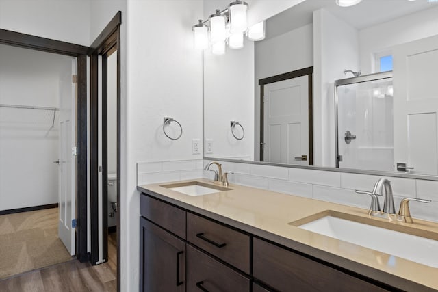 6701 Sockeye Ln, Pasco, WA 99301 - bathroom featuring vanity, wood-type flooring, and an enclosed shower