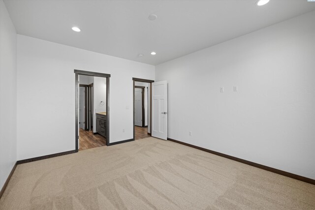 6701 Sockeye Ln, Pasco, WA 99301 - unfurnished bedroom with ensuite bathroom and light colored carpet