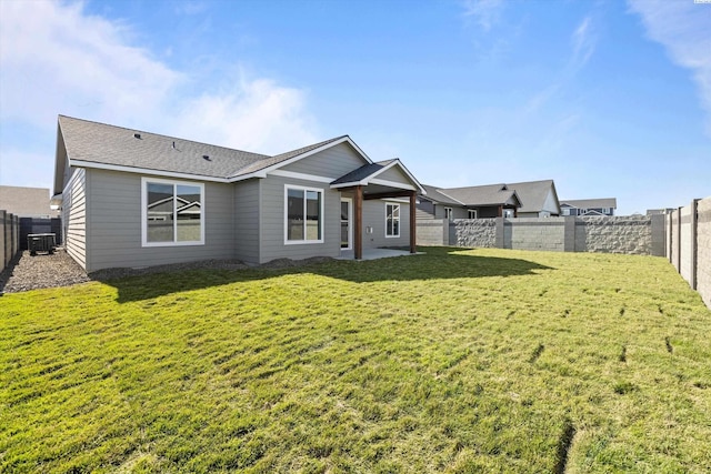 6701 Sockeye Ln, Pasco, WA 99301 - view of front facade with central AC, a patio area, and a front yard