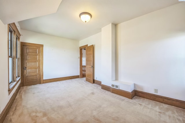 empty room with carpet flooring