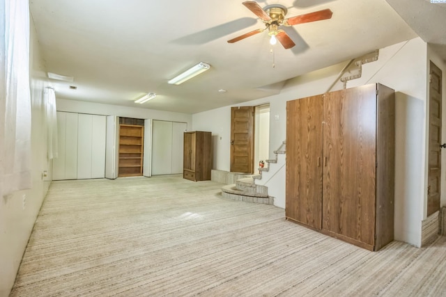 interior space featuring ceiling fan