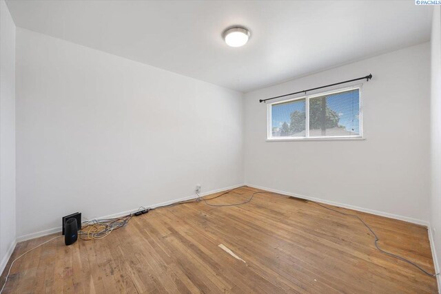 1925 Everest Ave, Richland, WA 99354 - spare room with baseboards and wood finished floors