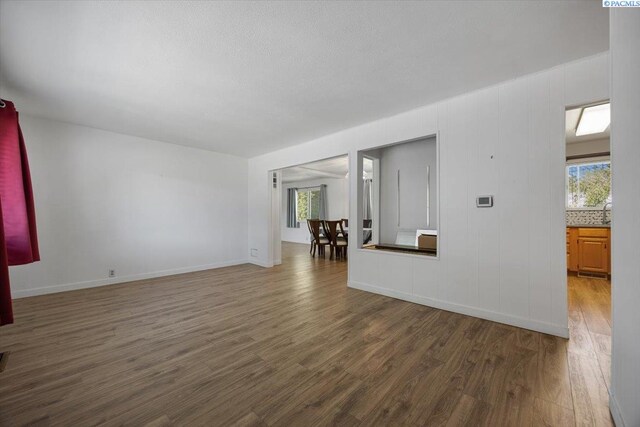 1925 Everest Ave, Richland, WA 99354 - unfurnished living room featuring wood finished floors and baseboards