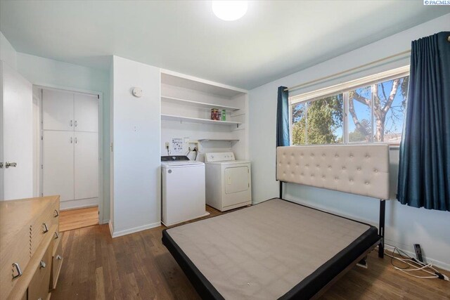 1925 Everest Ave, Richland, WA 99354 - bedroom featuring washing machine and dryer, dark wood-type flooring, and baseboards