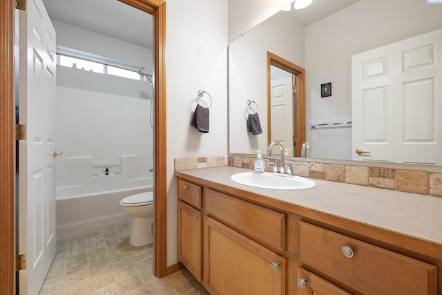 full bathroom featuring vanity, bathing tub / shower combination, and toilet