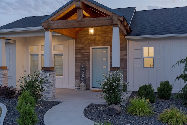 6514 Eagle Crest Dr, Pasco, WA 99301 - entrance to property featuring a porch, stone siding, board and batten siding, and a shingled roof