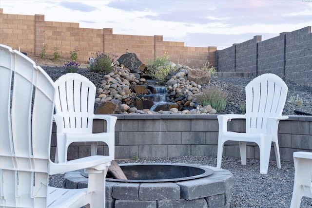 6514 Eagle Crest Dr, Pasco, WA 99301 - view of patio featuring fence and a fire pit