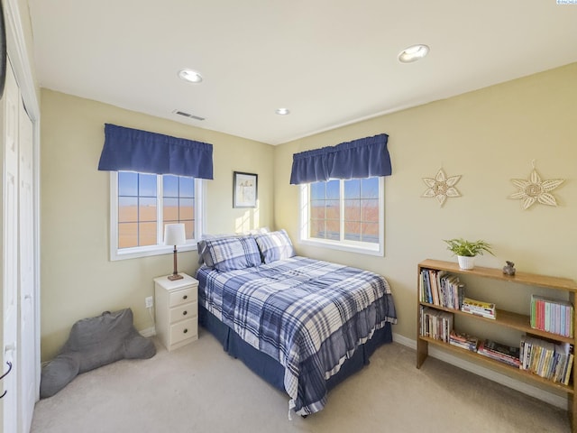 carpeted bedroom featuring a closet