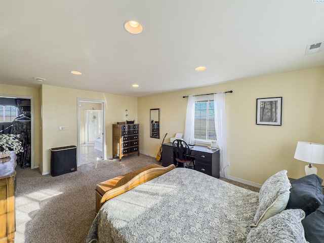 bedroom featuring carpet flooring and connected bathroom