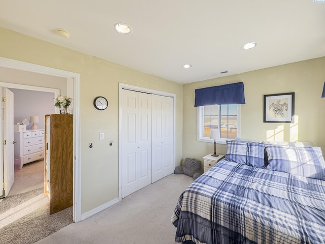 carpeted bedroom featuring a closet