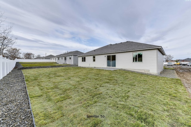 2880 S Osborne St, Kennewick, WA 99338 - back of house featuring fence, a lawn, and roof with shingles