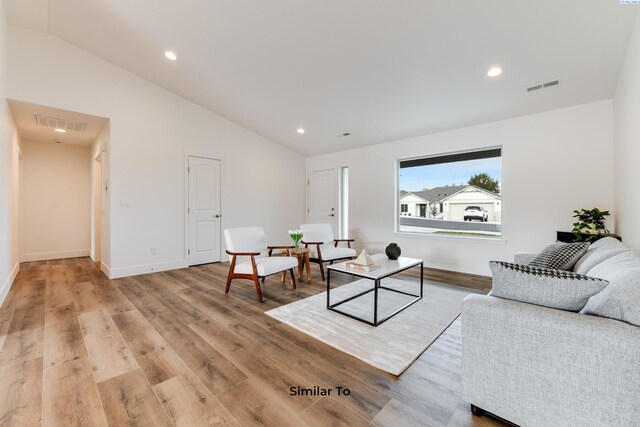 2880 S Osborne St, Kennewick, WA 99338 - living room with visible vents, light wood-style flooring, vaulted ceiling, and baseboards