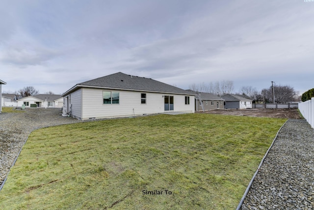 2880 S Osborne St, Kennewick, WA 99338 - rear view of property with fence, a lawn, crawl space, and roof with shingles