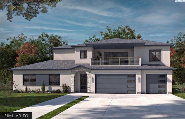 prairie-style house featuring a balcony, a garage, and a front yard