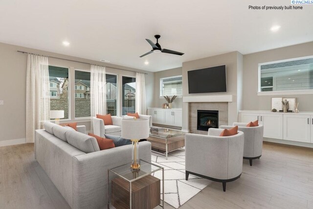 2816 Avrio Ave, Richland, WA 99354 - living room with a ceiling fan, a tiled fireplace, light wood finished floors, recessed lighting, and baseboards