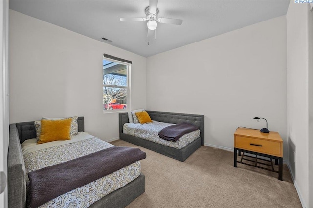 bedroom with carpet flooring, baseboards, and ceiling fan