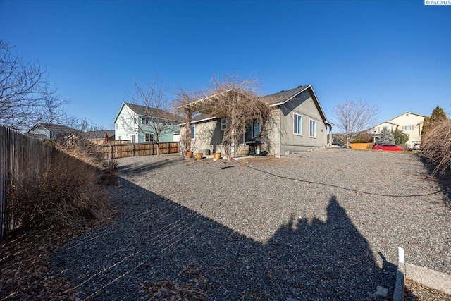 back of property with a fenced backyard
