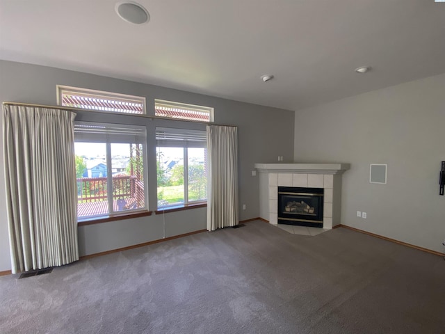 2665 Maidstone St, Richland, WA 99354 - unfurnished living room featuring carpet, a tiled fireplace, and baseboards
