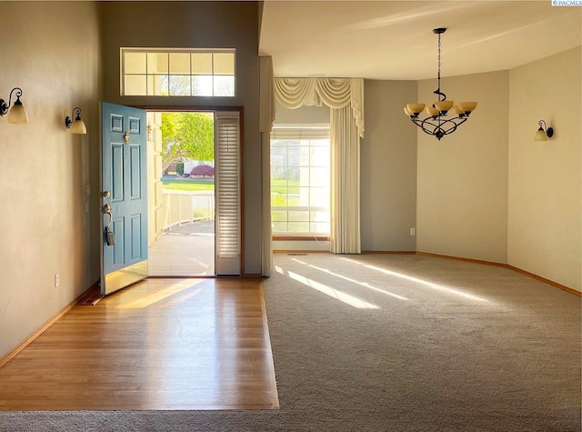 2665 Maidstone St, Richland, WA 99354 - entrance foyer featuring a chandelier, baseboards, and wood finished floors