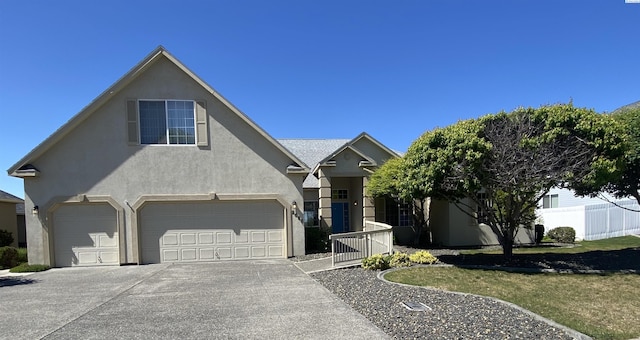 2665 Maidstone St, Richland, WA 99354 - traditional-style home with driveway, stucco siding, a garage, and fence
