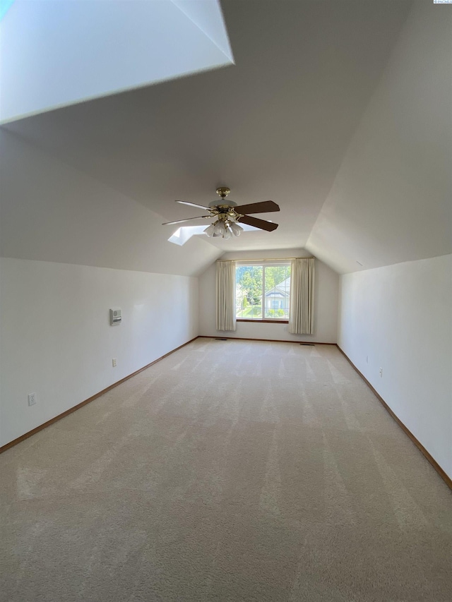 2665 Maidstone St, Richland, WA 99354 - bonus room featuring lofted ceiling, a ceiling fan, light carpet, baseboards, and a skylight