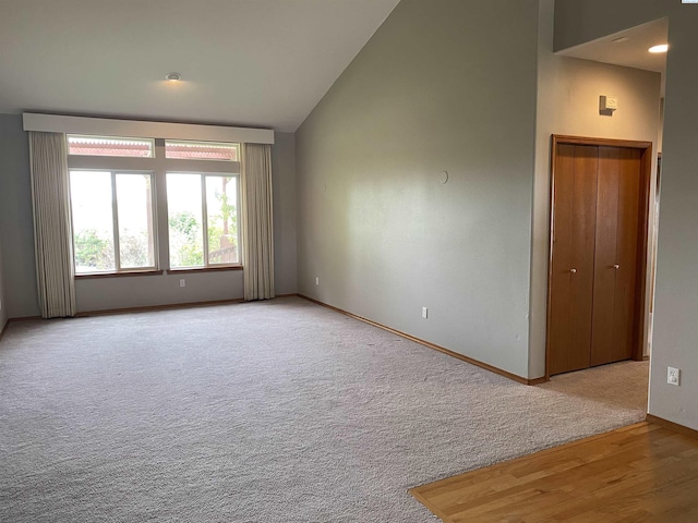 2665 Maidstone St, Richland, WA 99354 - spare room featuring vaulted ceiling, baseboards, and carpet flooring
