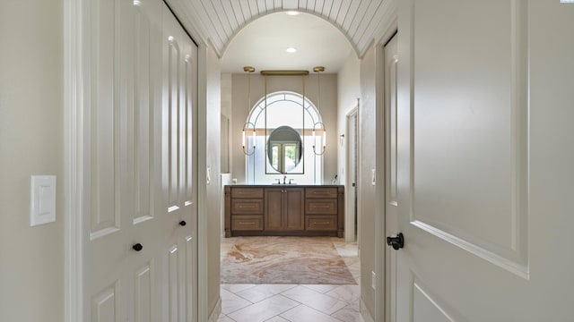 3304 Sorento Ct, Pasco, WA 99301 - doorway featuring a sink, light marble finish flooring, and arched walkways