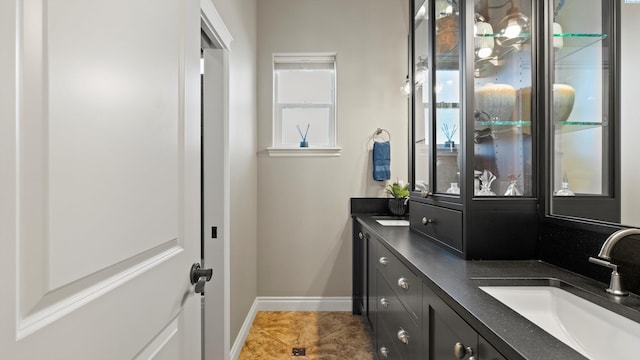 3304 Sorento Ct, Pasco, WA 99301 - bathroom with double vanity, baseboards, and tile patterned floors