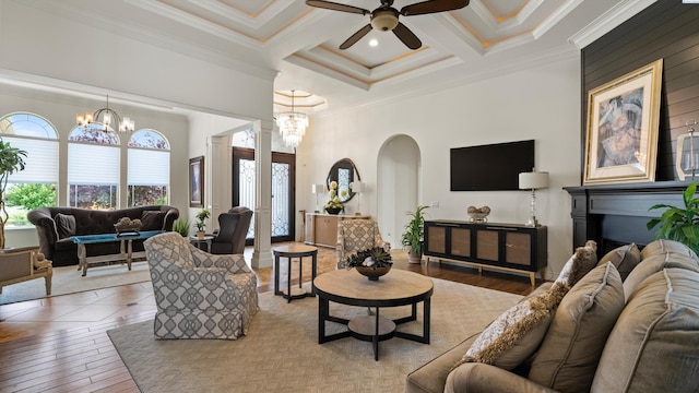 3304 Sorento Ct, Pasco, WA 99301 - living room with ornamental molding, arched walkways, beam ceiling, a ceiling fan, and coffered ceiling