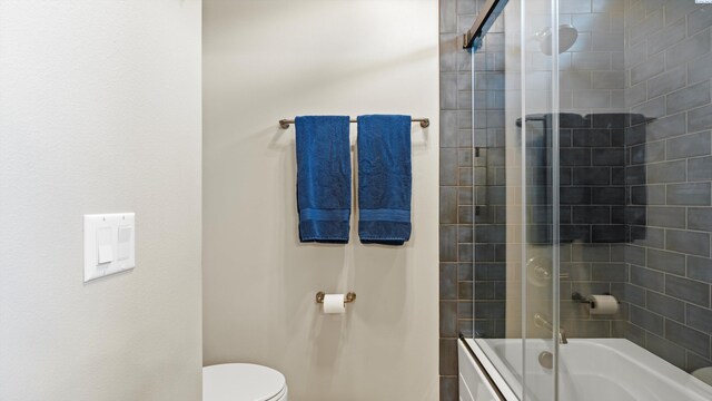 3304 Sorento Ct, Pasco, WA 99301 - bathroom featuring bath / shower combo with glass door and toilet