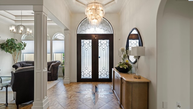 3304 Sorento Ct, Pasco, WA 99301 - entryway featuring a chandelier, a raised ceiling, ornamental molding, arched walkways, and french doors