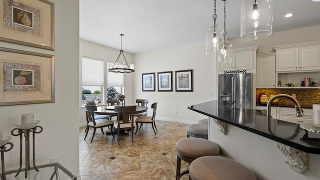 3304 Sorento Ct, Pasco, WA 99301 - dining area with baseboards, a chandelier, recessed lighting, and light tile patterned floors