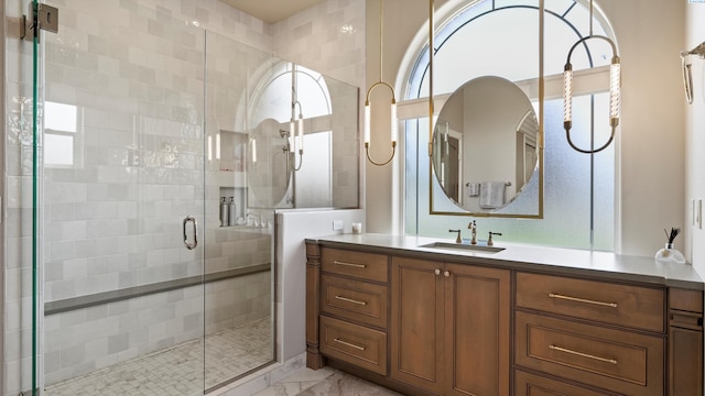 3304 Sorento Ct, Pasco, WA 99301 - bathroom with vanity, marble look tiles, and a stall shower