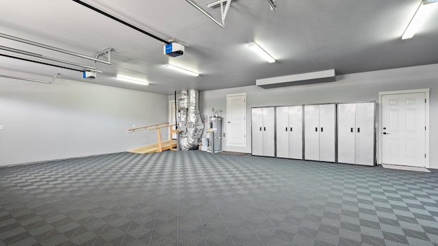 3304 Sorento Ct, Pasco, WA 99301 - garage with electric water heater and a garage door opener