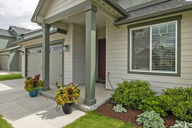 doorway to property featuring a garage