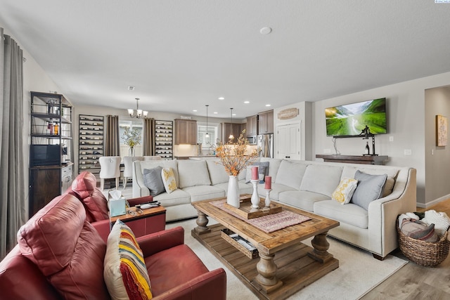 1409 Centennial Ave, Sunnyside, WA 98944 - living room with a chandelier and light wood-type flooring