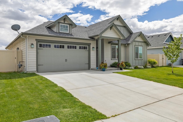 view of front of house featuring a garage and a front yard