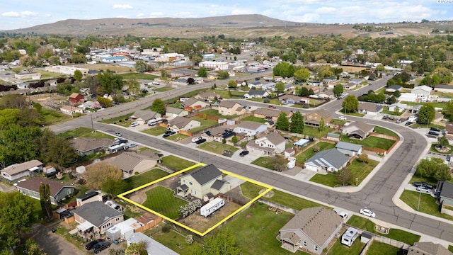 bird's eye view with a residential view and a mountain view
