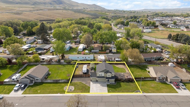 birds eye view of property with a residential view and a mountain view