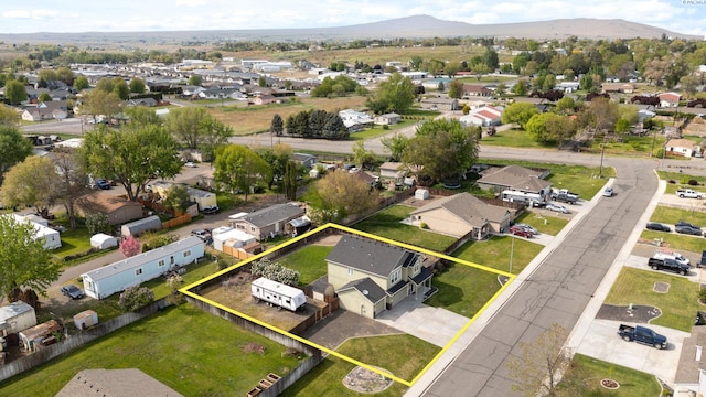 birds eye view of property with a residential view and a mountain view