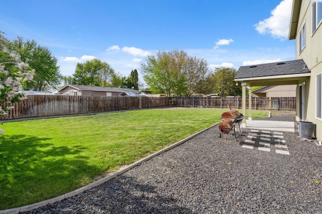 view of yard with a fenced backyard and a patio area