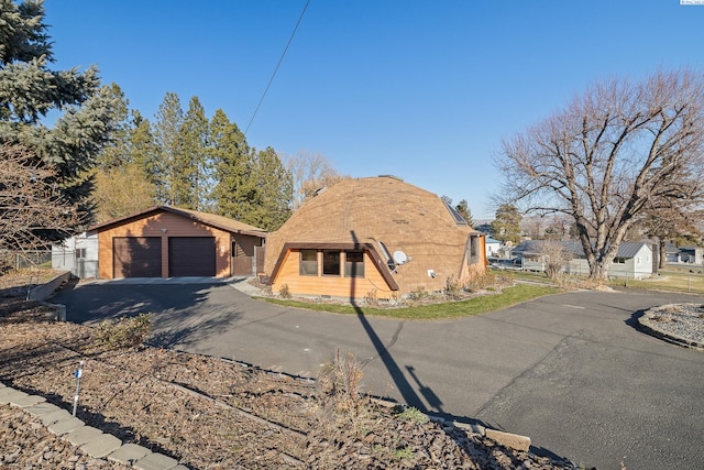 view of front of property featuring an outbuilding and a garage