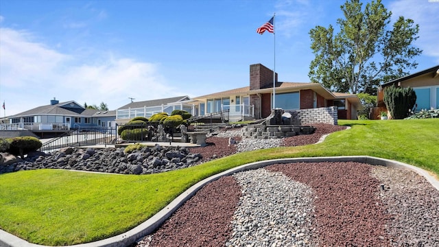 2003 W Canal Dr, Kennewick, WA 99336 - back of house with brick siding, a chimney, a yard, and a residential view